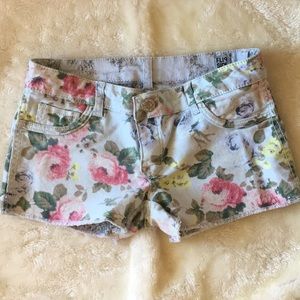 Reversible small floral and snakeskin jean shorts